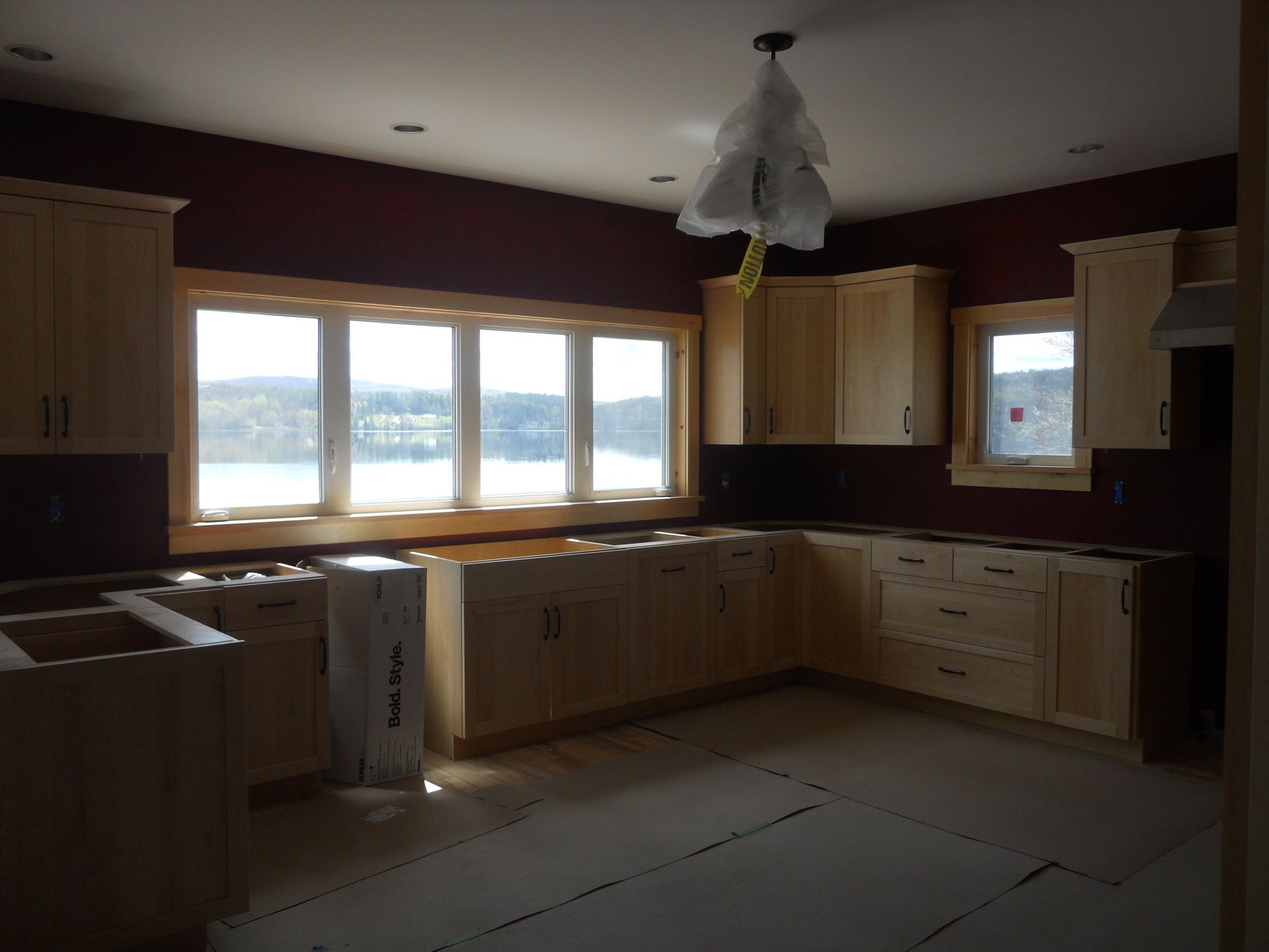A kitchen with wooden cabinets and a box that says ' ram ' on it