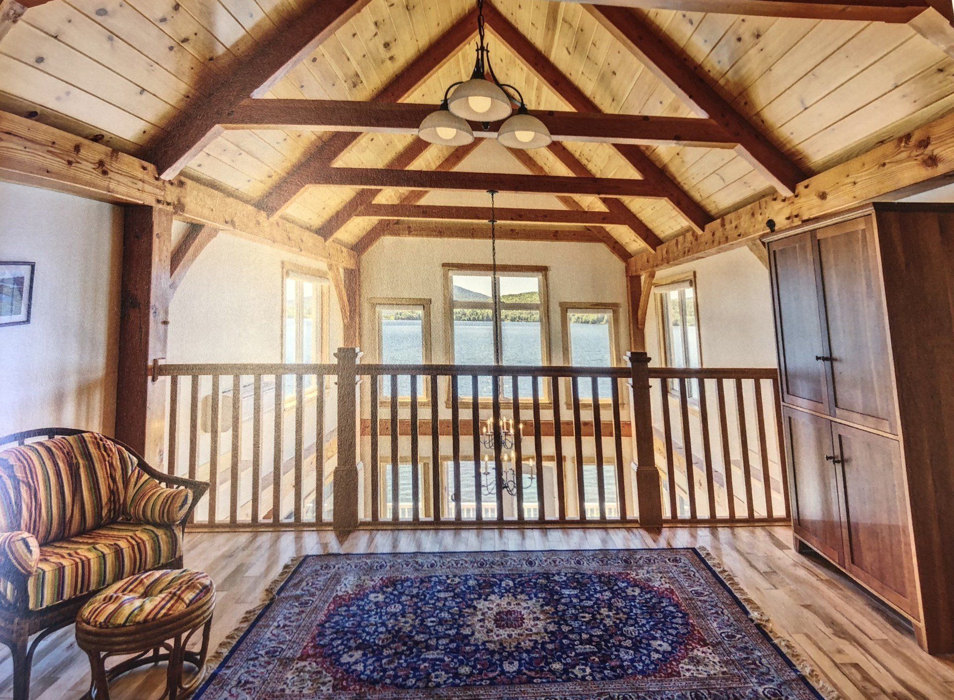 A room with a wooden railing and a rug on the floor
