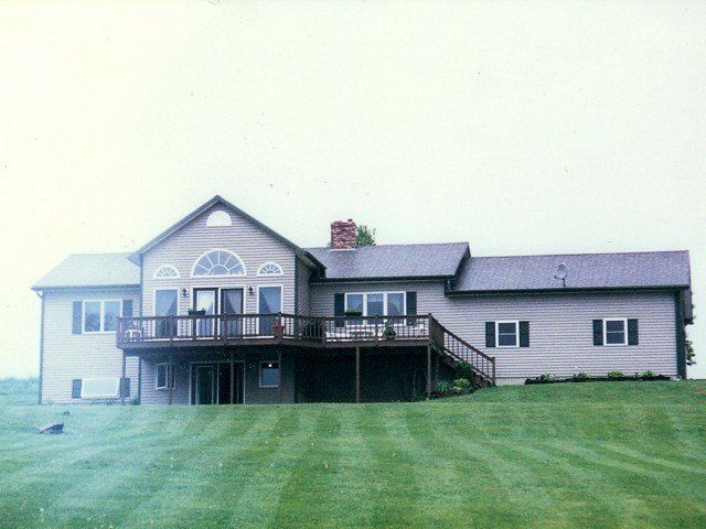 A large house with a large lawn in front of it