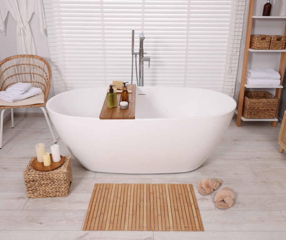 A bathroom with a bathtub, chair and bamboo accessories