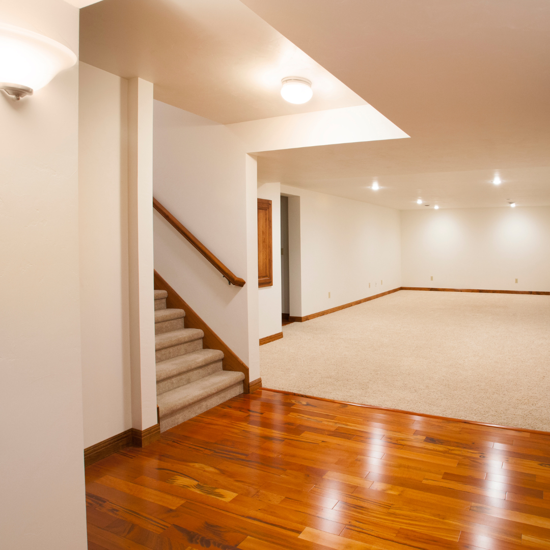 Finished basement with white walls in a Vermont home.