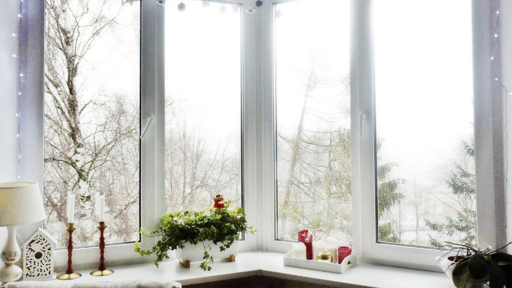 Large windows looking out onto a snowy Vermont landscape.