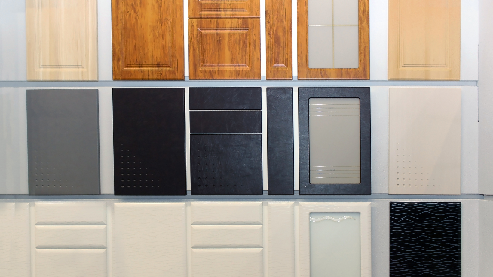 An array of various kitchen cabinet styles such as raised panel, flat panel, shaker and glass front
