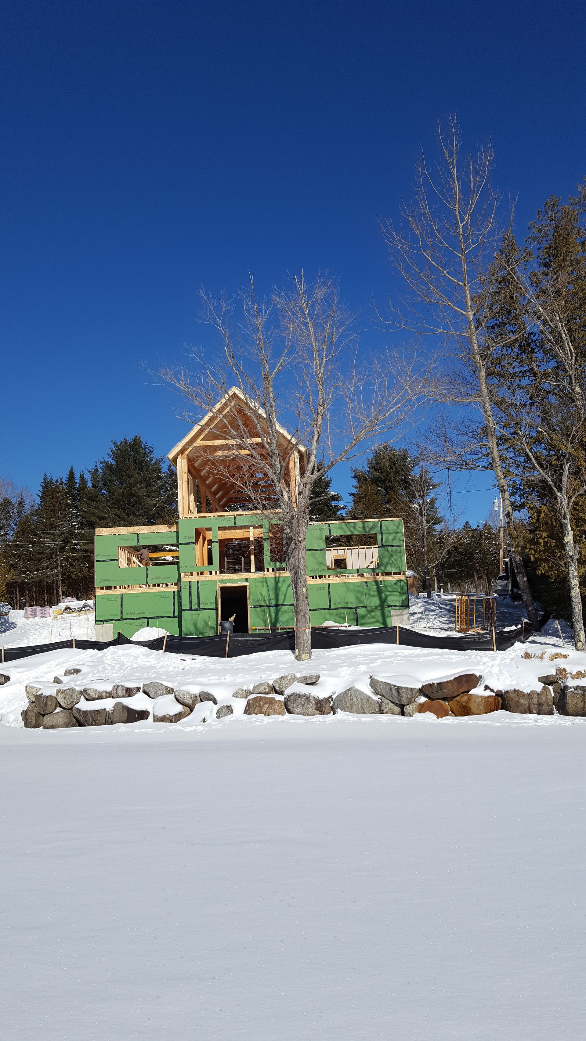 A house that is being built in the snow