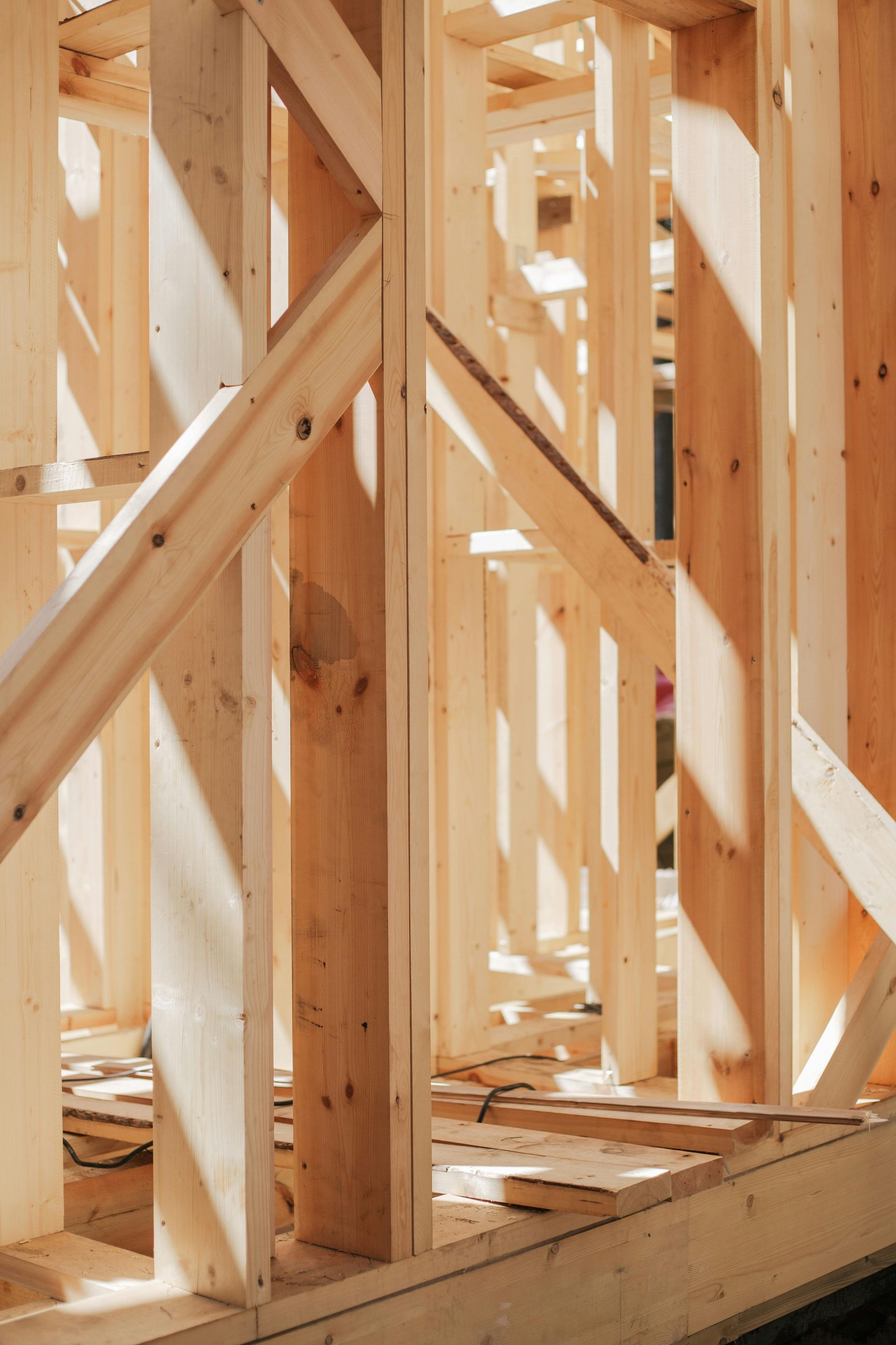 A wooden frame of a building under construction