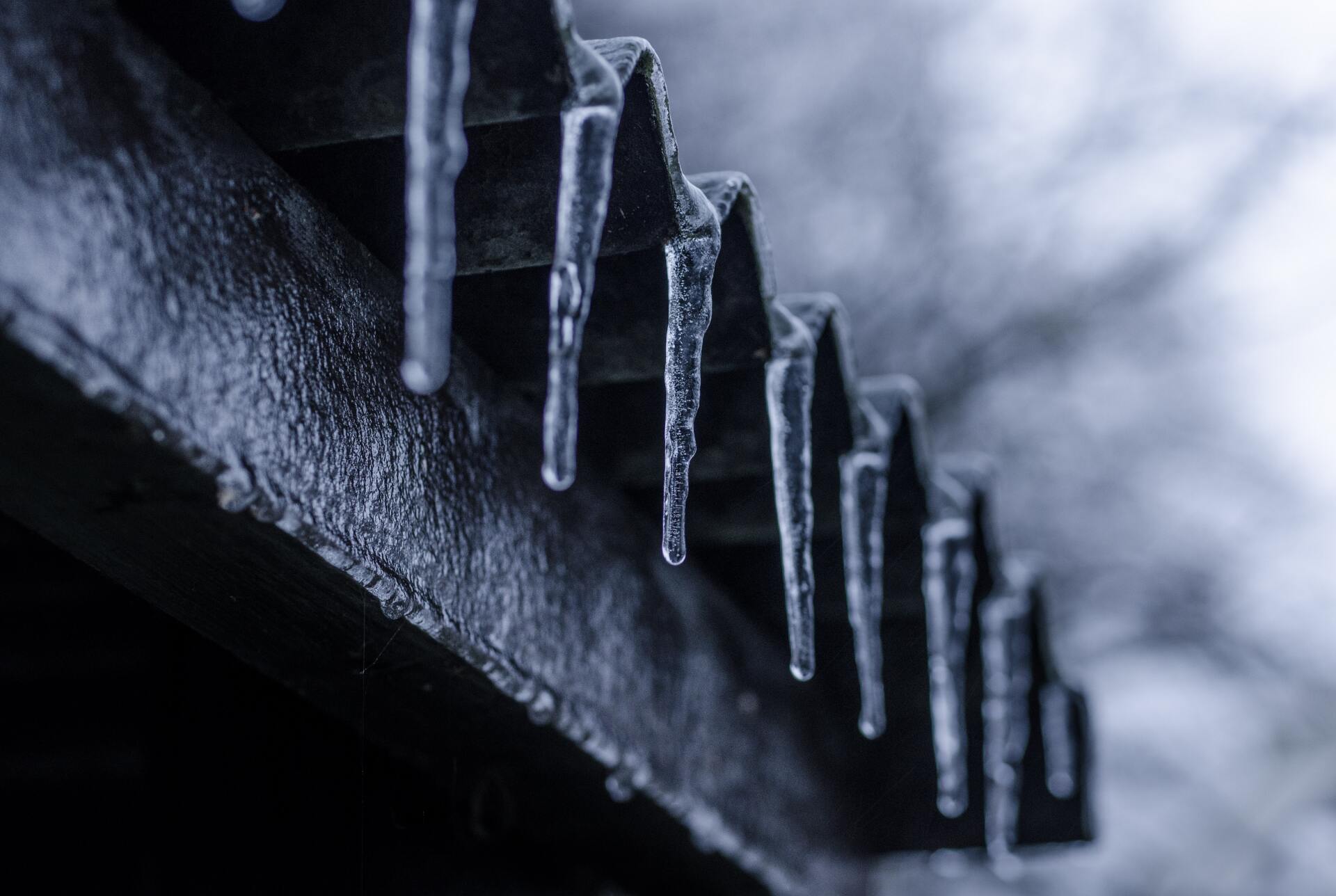 icicles hanging off of a roof