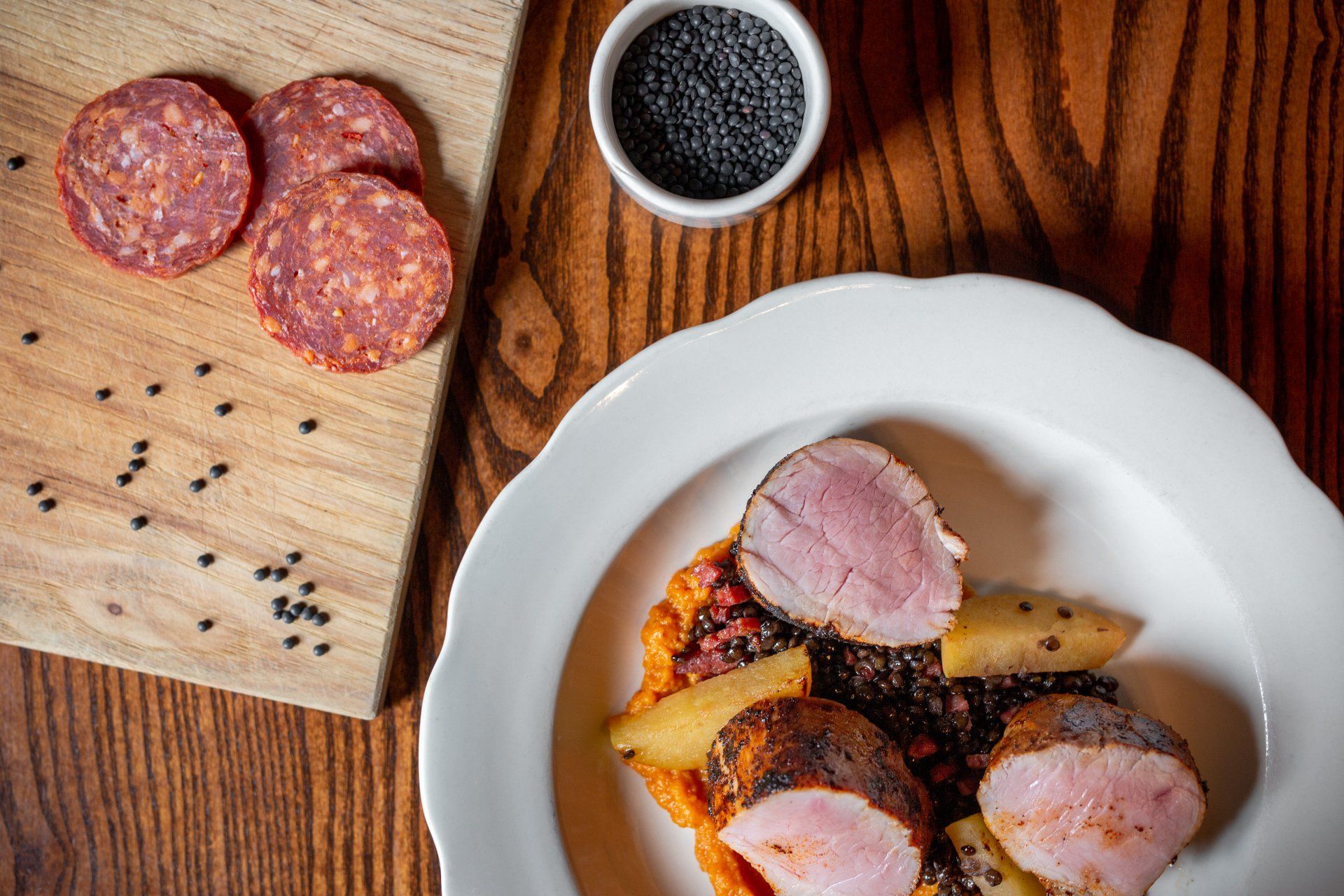 white plate with pork tenderloin and potatoes at planter's house st. louis
