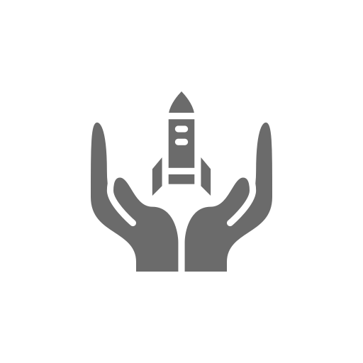 A pair of hands holding a rocket in their hands.