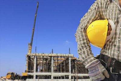 Construction Injury — Construction Worker Holding The Hard Hat in Saginaw, MI