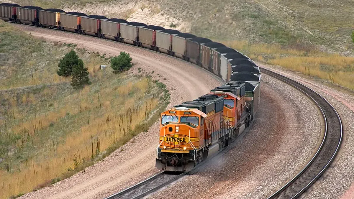 A BNSF train hauls coal. A BNSF train hauls coal.
