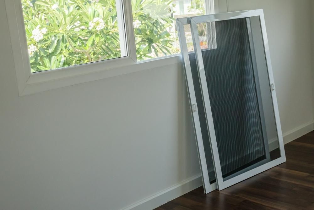 Two Screen Doors Are Sitting Next to A Window in A Room — Grafton Glass in South Grafton, NSW