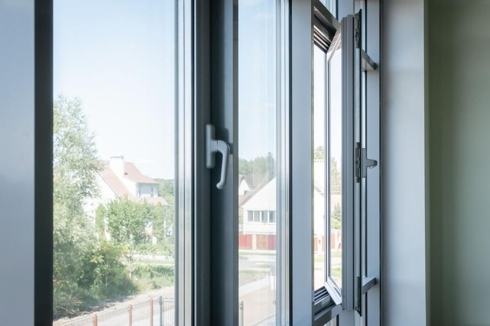 A Close up Of an Open Window with A View of A House — Grafton Glass in South Grafton, NSW