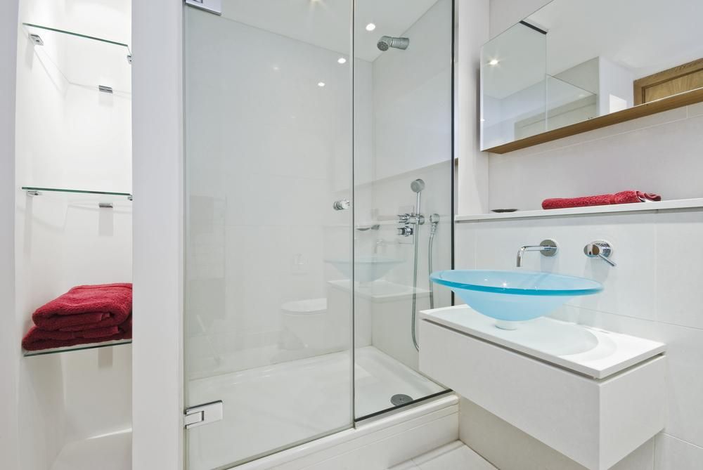 A Bathroom with A Glass Shower Door and A Sink — Grafton Glass in South Grafton, NSW