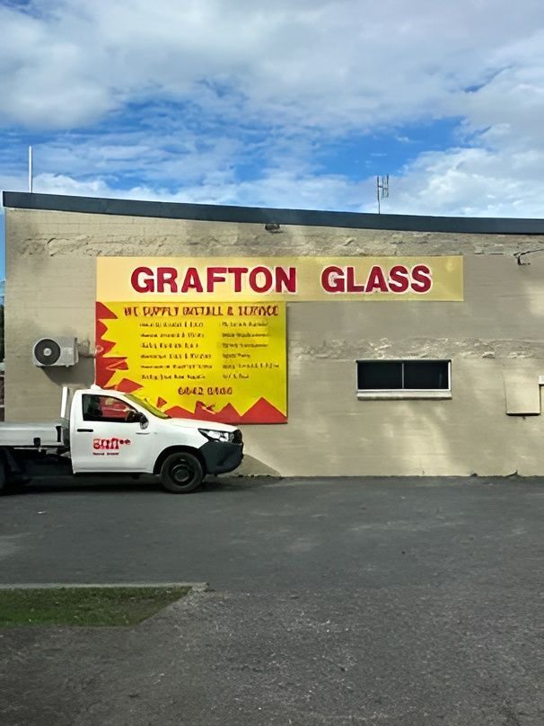 A Truck Is Parked in Front of A Building that Says Grafton Glass — Grafton Glass in South Grafton, NSW