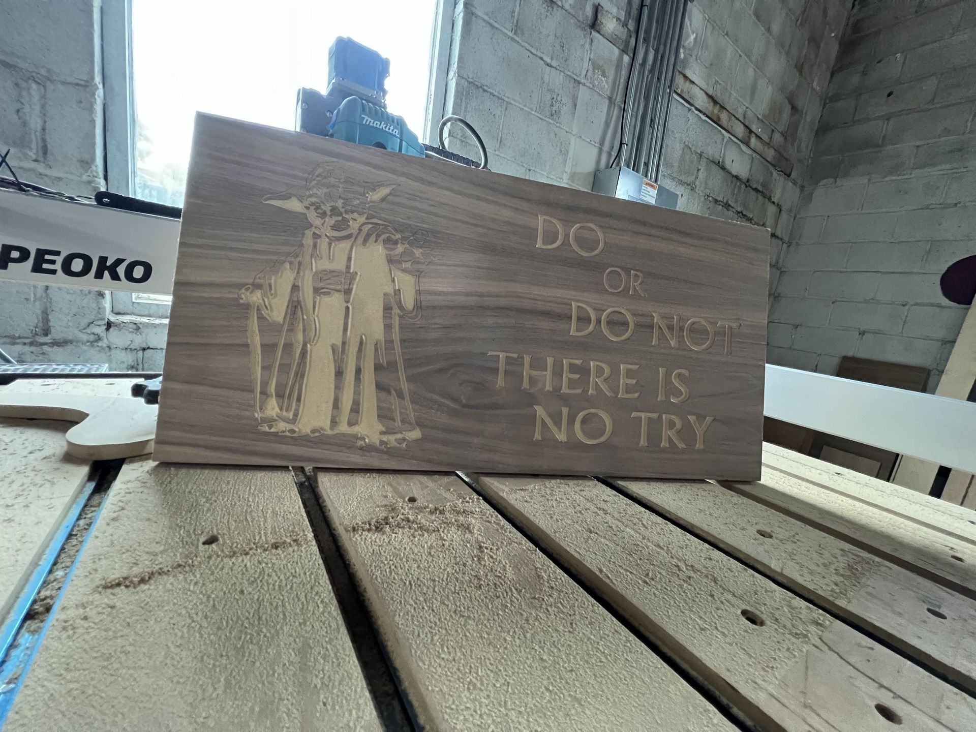 A wooden sign that says do or do not there is no try