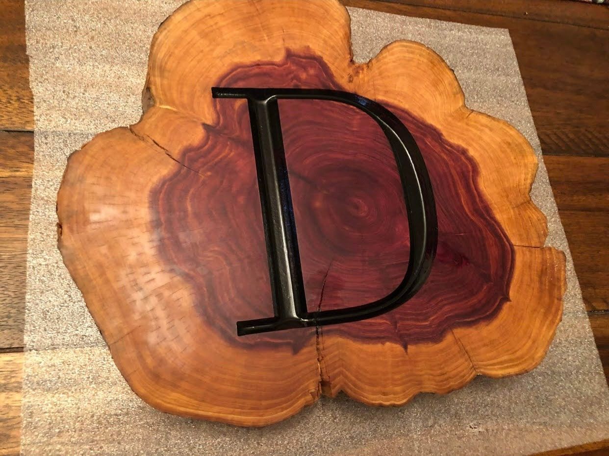 A piece of wood with a letter d on it