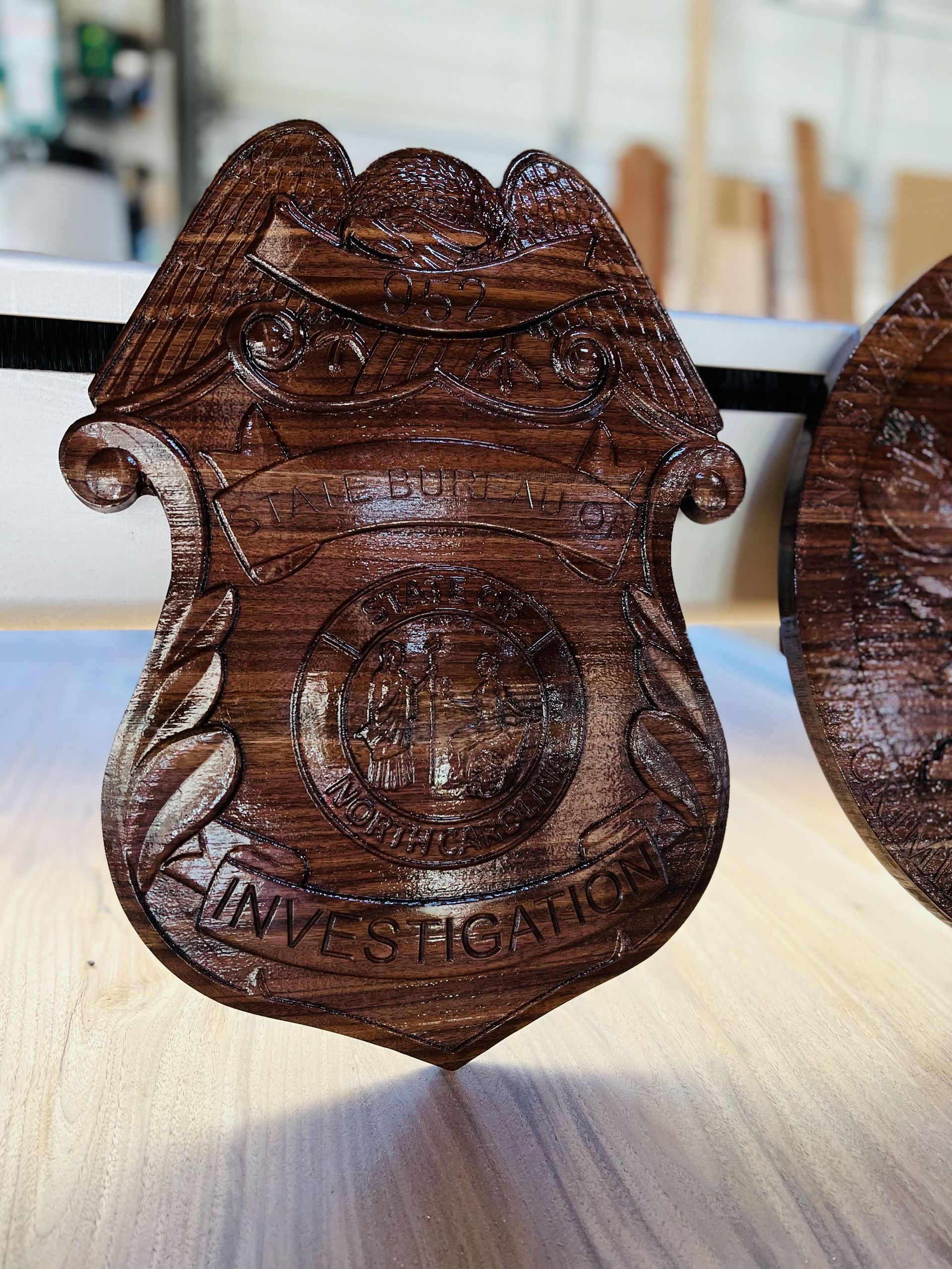 A wooden badge with the word investigation on it