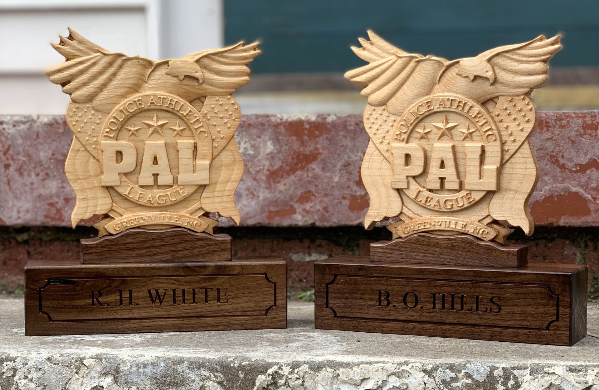Two wooden plaques with the word pal on them