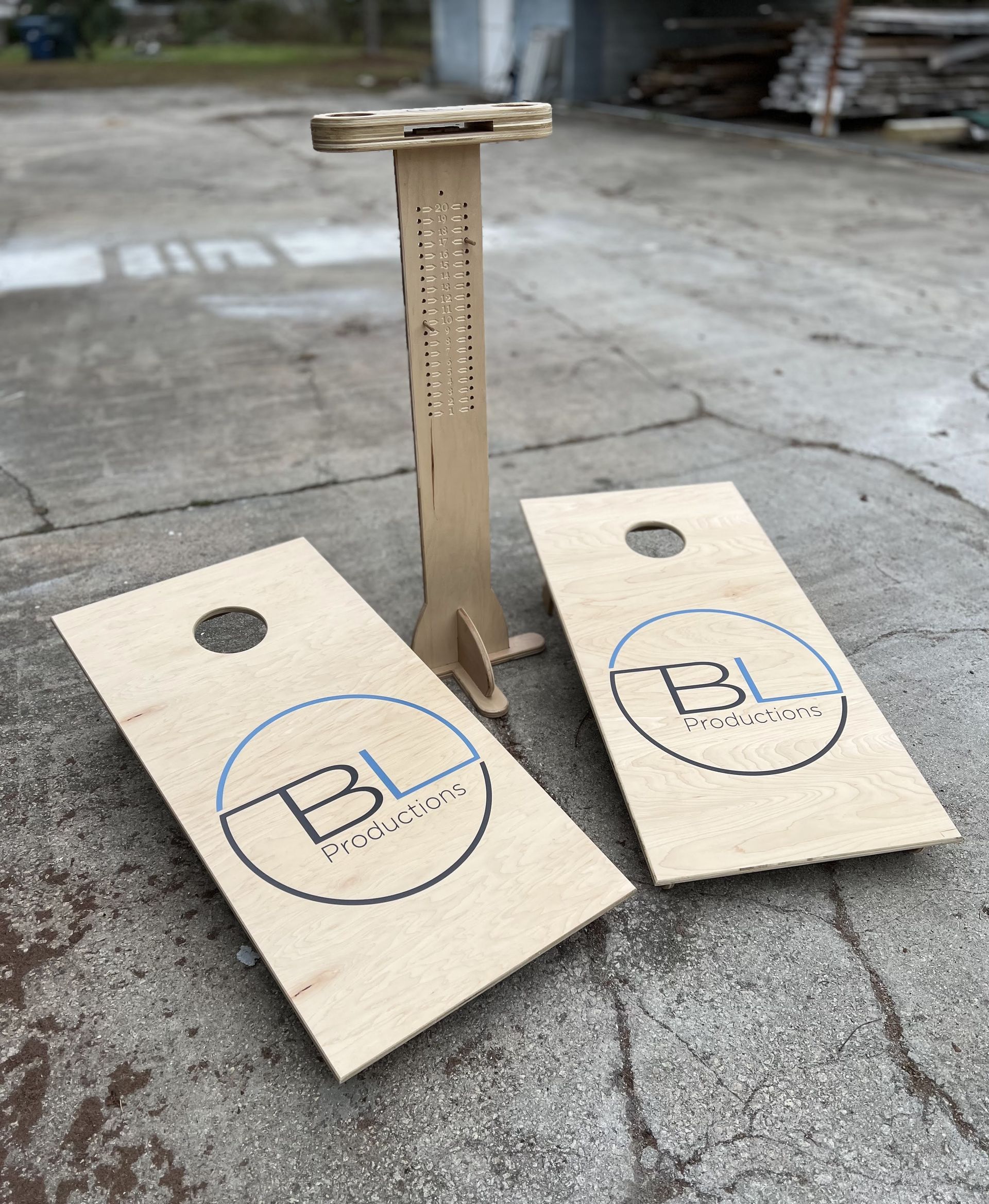 Two wooden cornhole boards with bl written on them