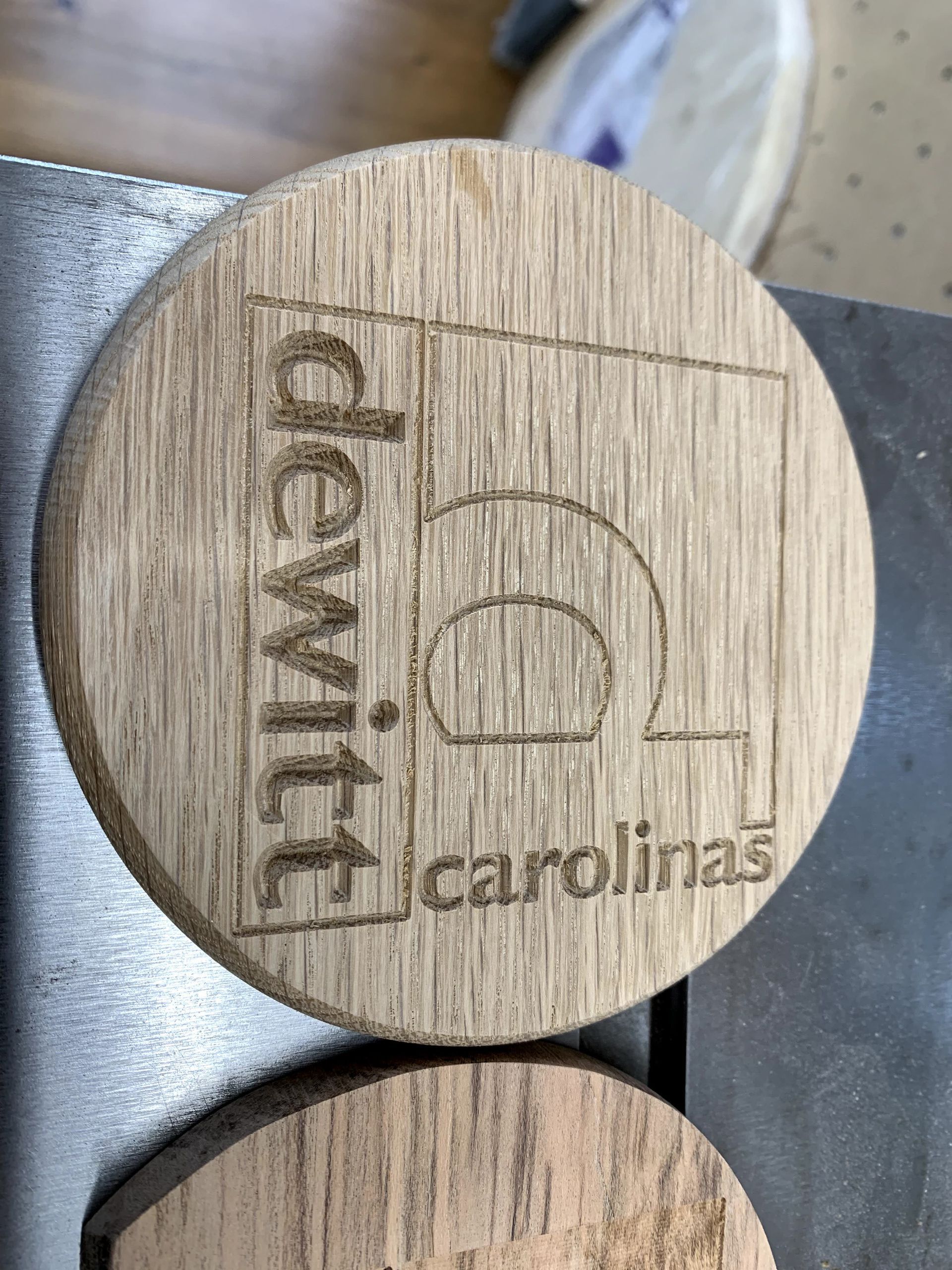 A wooden circle that says dewit carolina on it