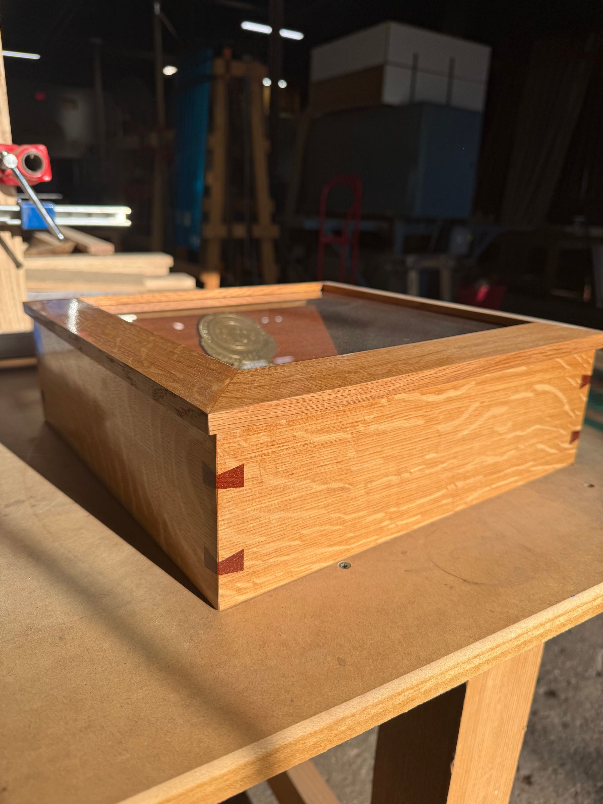 A wooden box is sitting on a wooden table