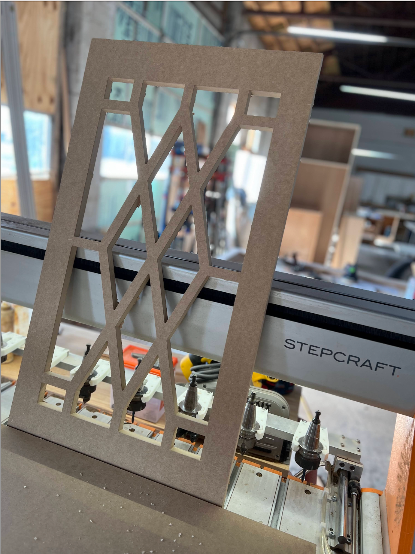 A piece of wood is sitting on top of a machine.