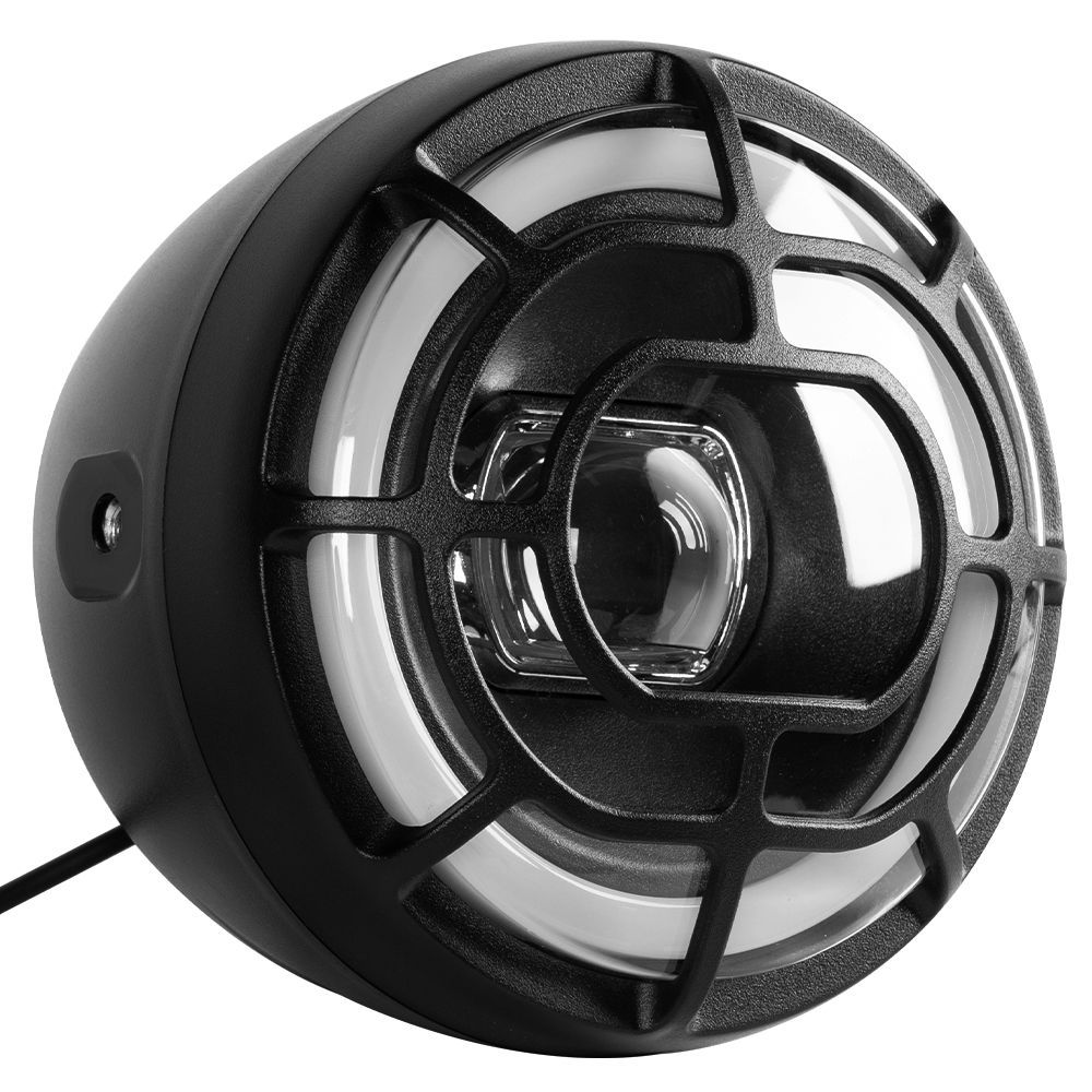Black and white headlight with a protective grill and white LED ring.