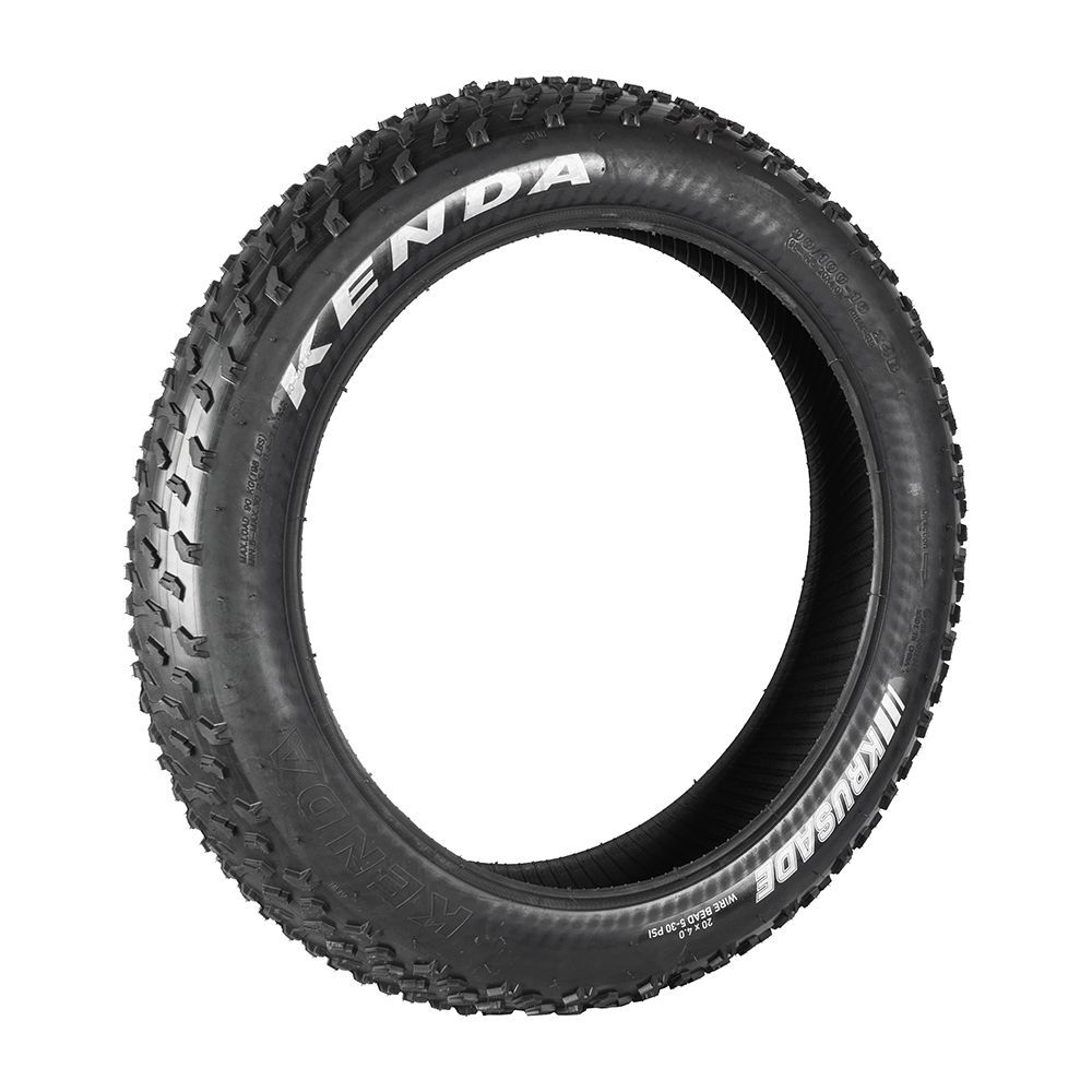 Black Kenda Juggernaut fat bike tire with prominent tread.