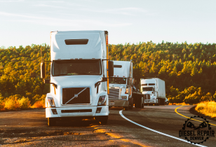 A row of semi trucks are driving down a road in denver colorado.