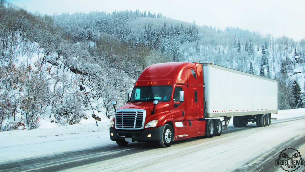 A red semi truck is driving down a snowy highway in Colorado.