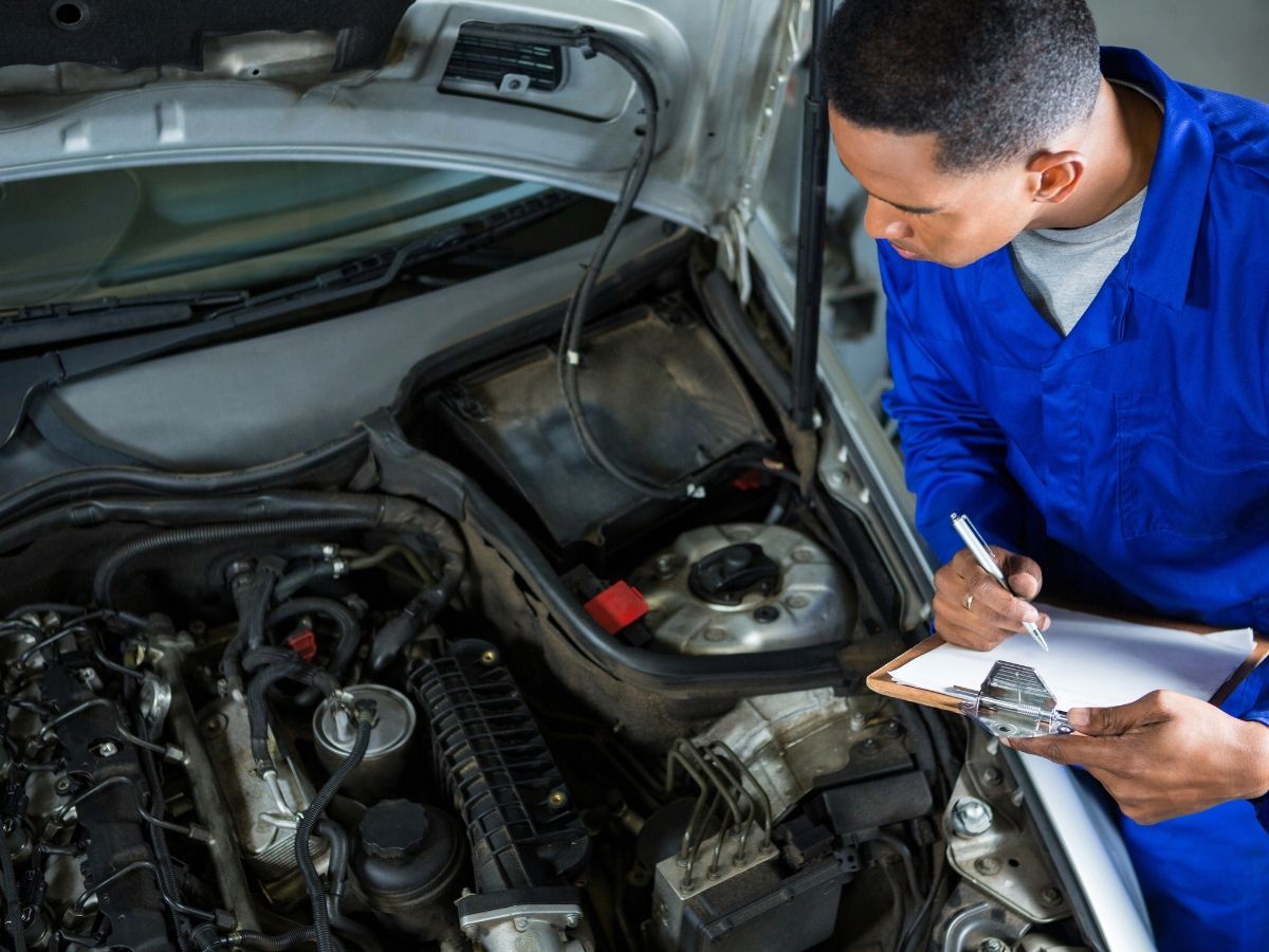 Mechanic working on a light duty diesel fuel system repair Denver CO