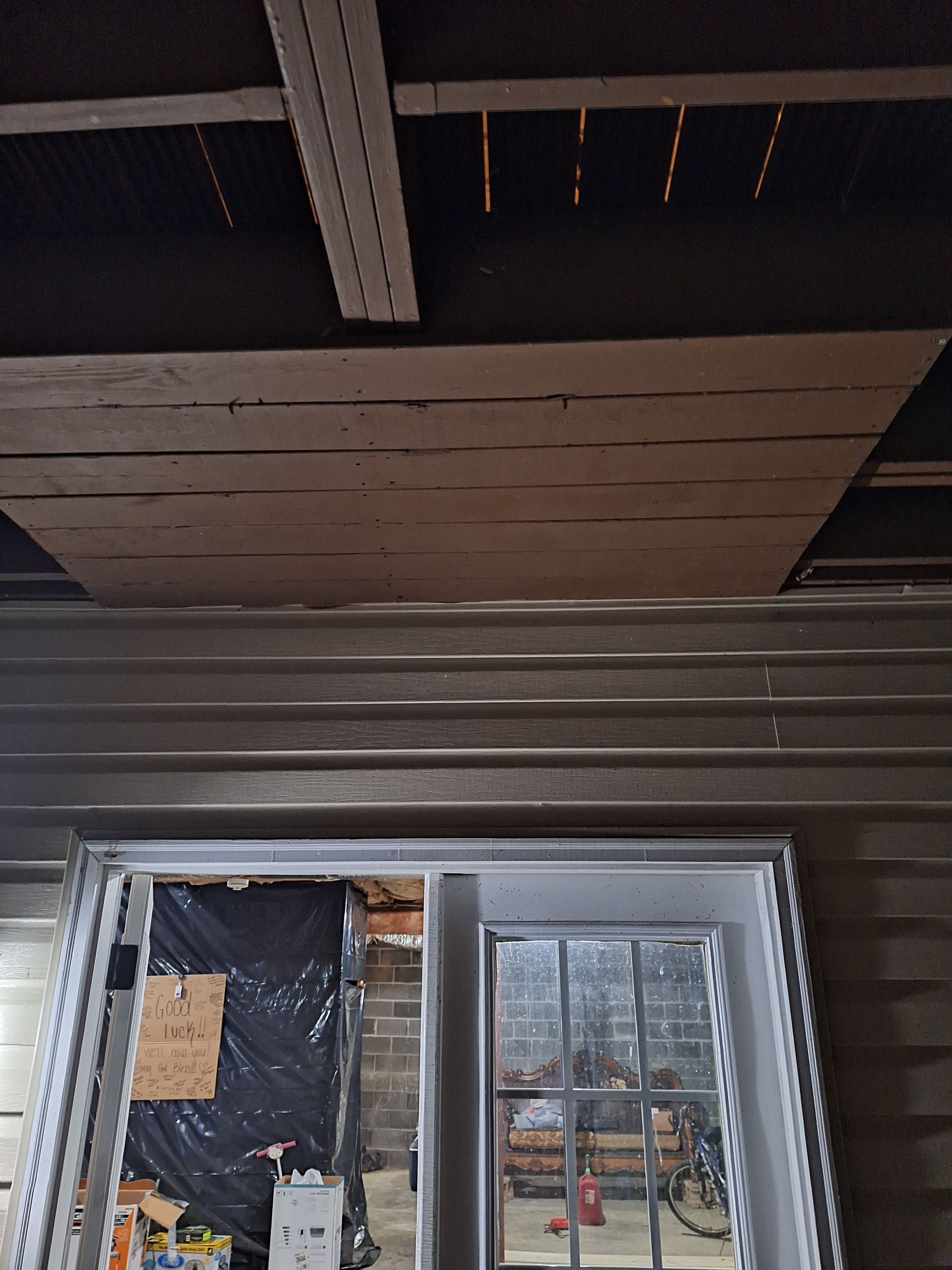 Looking up at the ceiling of a room with a window