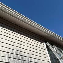 A ladder is attached to the side of a house.