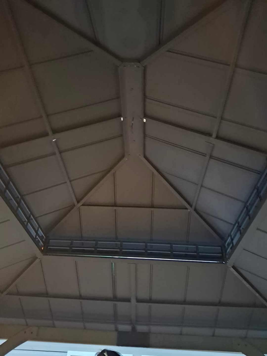 Looking up at the ceiling of a building.