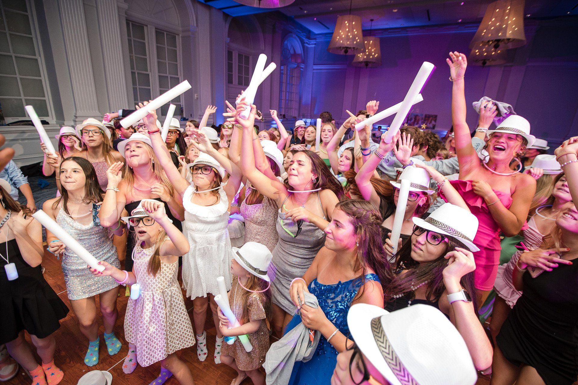 Bat Mitzvah party with everyone on dance floor and hands in air