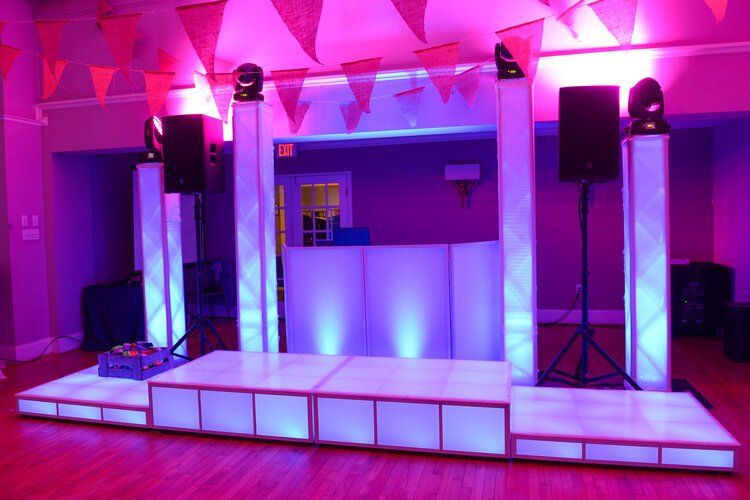 Tiered LED stages that is prepared for guests to stand on.