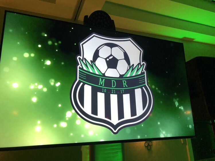 TC screen displaying a soccer logo with soccer ball.