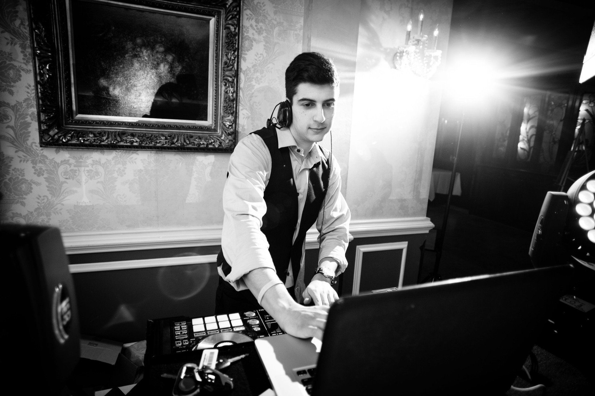 DJ mixing music for a wedding party using turntables