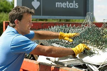 Srap Hauling — Man Collecting a Metal Scrap in Marion, IA