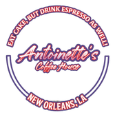 Neon sign for Antoinette's Coffee House: blue and white ring with text and name, a script font in red and white.