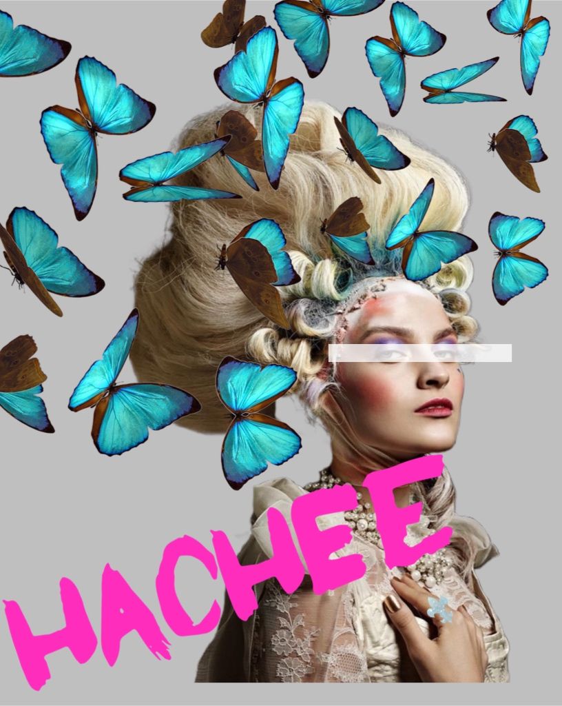 A white truck is parked in a parking lot next to a building.