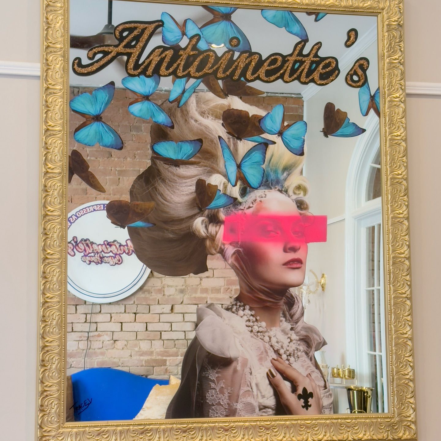 Mirror with collage of woman and butterflies; 