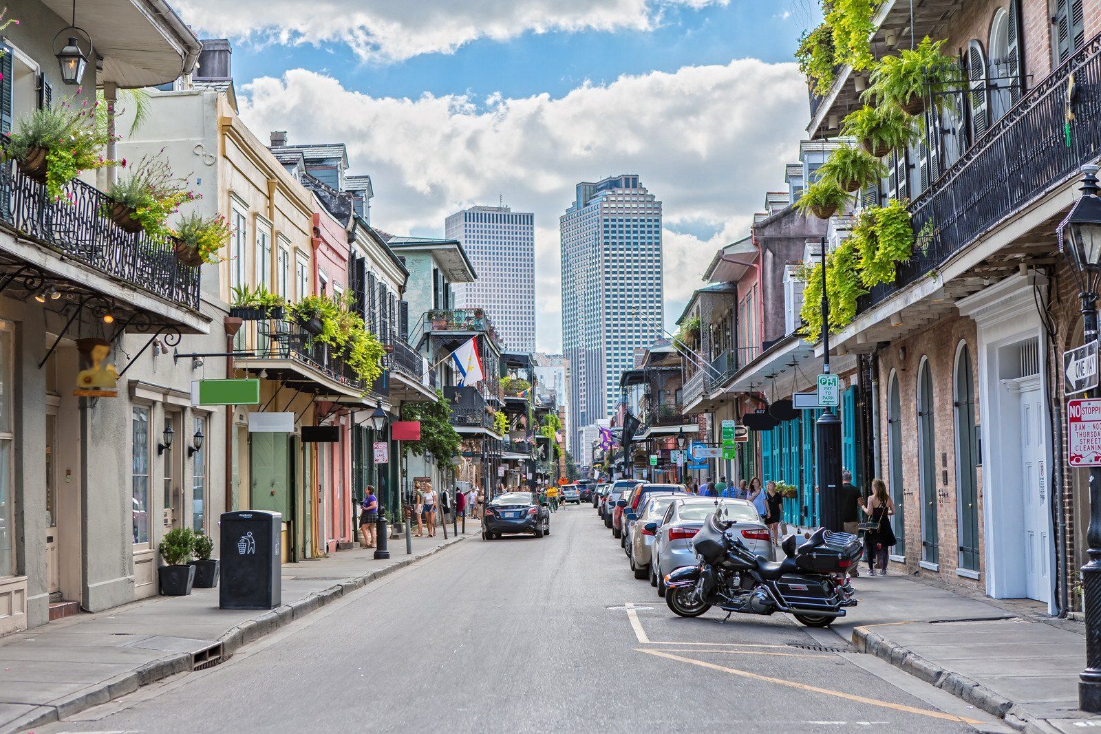 A motorcycle is parked on the side of a city street.