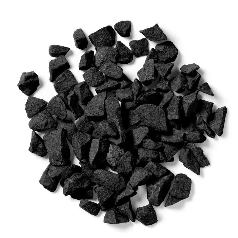Pile of small, dark gray, jagged rocks against a white background.