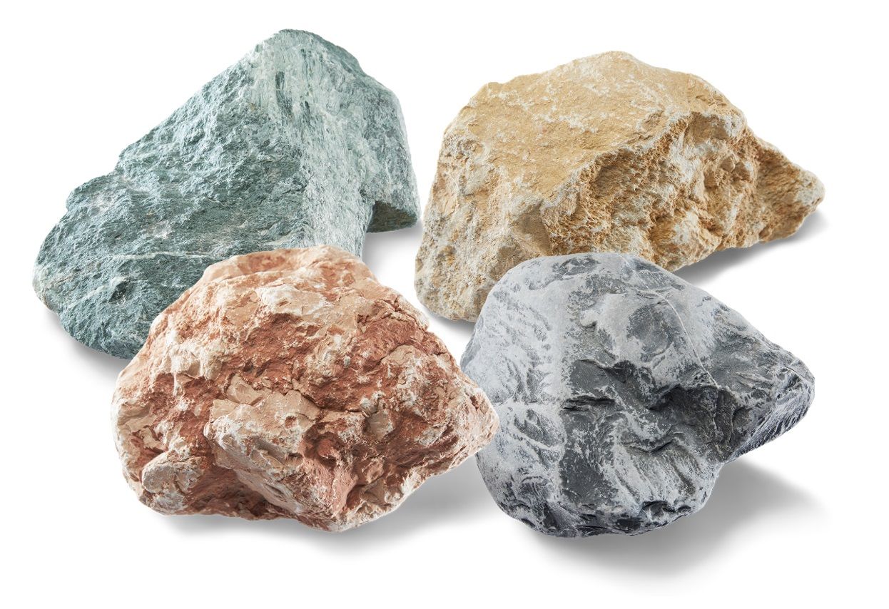 Four colorful rocks: green, tan, red, and gray, each with a rough, textured surface.
