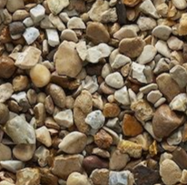 Small, multicolored river rocks scattered. Browns, tans, and grays create a natural texture.