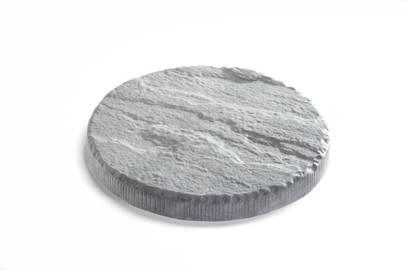 Circular gray stone coaster with textured surface, set against a white background.