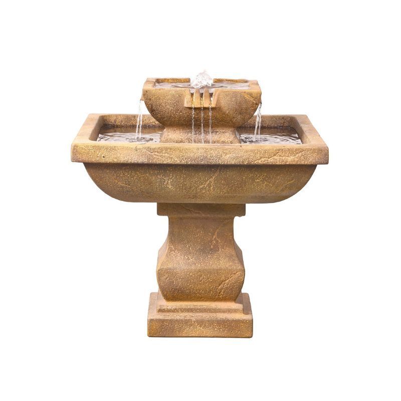 Outdoor stone water fountain with tiered basins and pedestal base.
