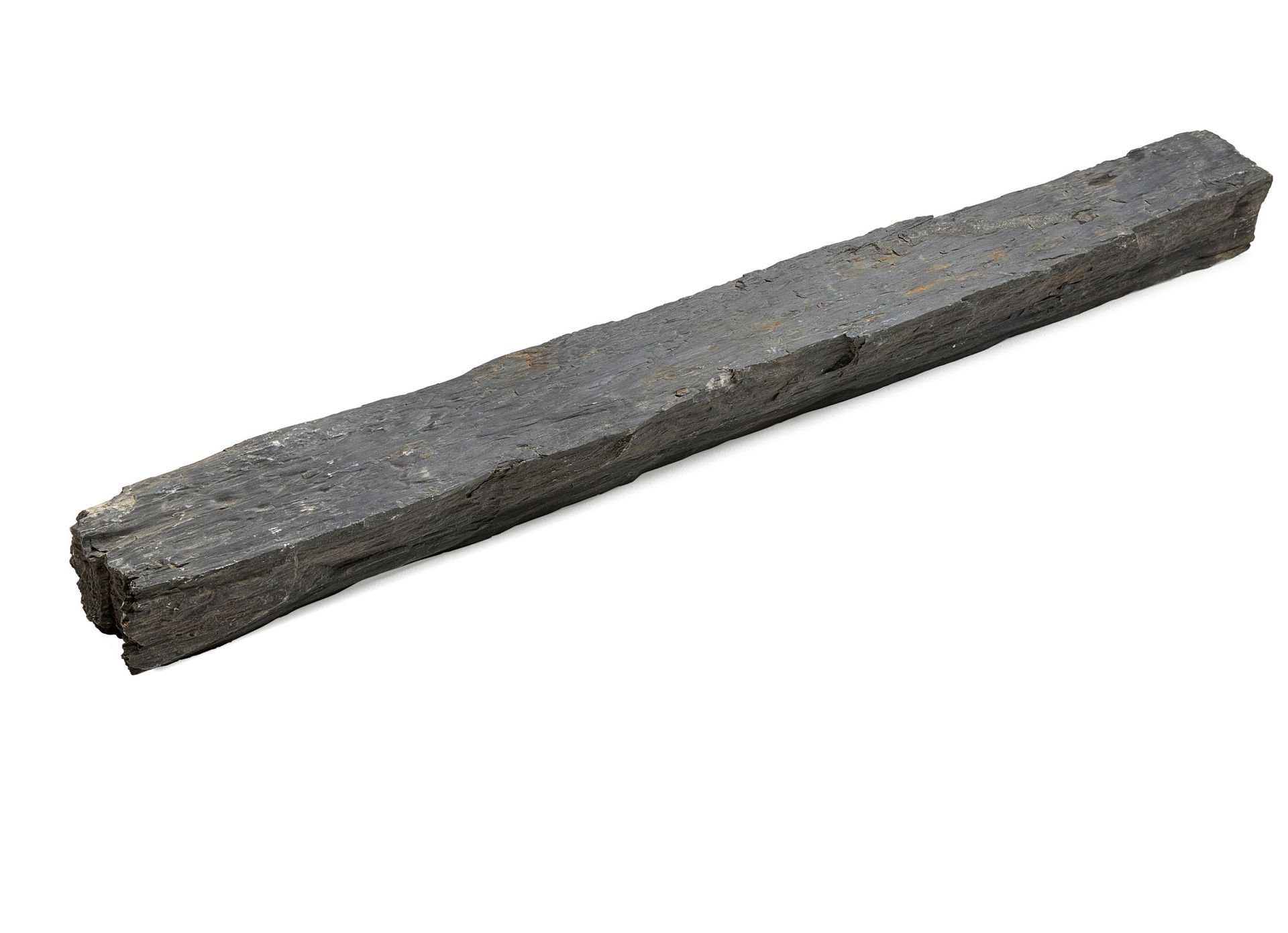 Rectangular charcoal stick, dark gray with rough texture, isolated on white.