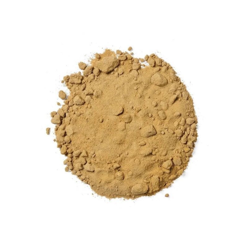 Pile of light brown powder, possibly a spice or ingredient.